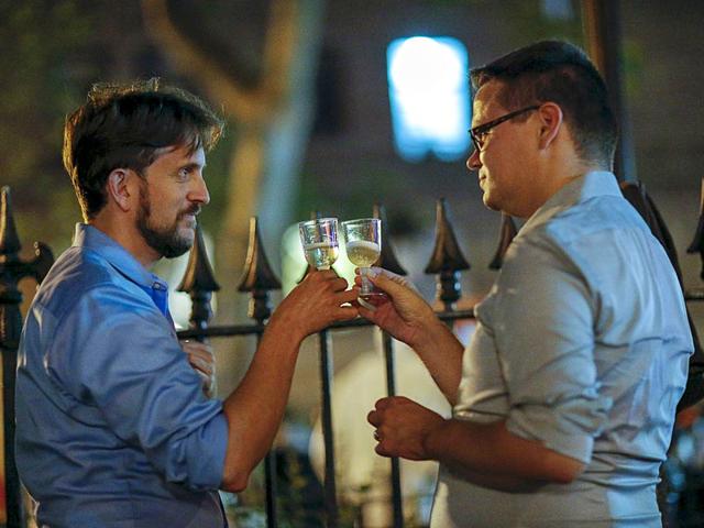 Men toast as people celebrate outside the Stonewall Inn, late in the night in the Greenwich Village neighbourhood of New York. (Reuters)