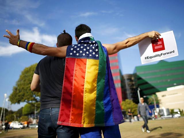 People pose for a photo at a celebration rally in West Hollywood, California. (Reuters)