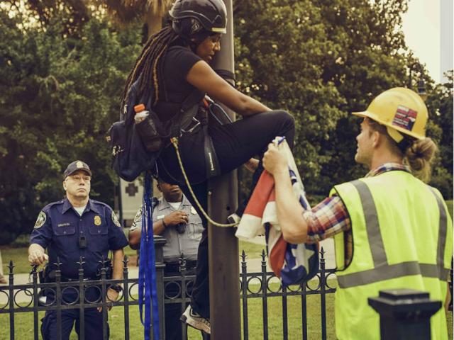 Bree-Newsome-takes-down-the-Confederate-Flag-from-a-pole-at-the-Statehouse-in-Columbia-South-Carolina-June-27-2015-Newsome-was-later-arrested-for-her-action-Reuters-Photo Bree-Newsome-takes-down-the-Confederate-Flag-from-a-pole-at-the-Statehouse-in-Columbia-South-Carolina-June-27-2015-Newsome-was-later-arrested-for-her-action-Reuters-Photo