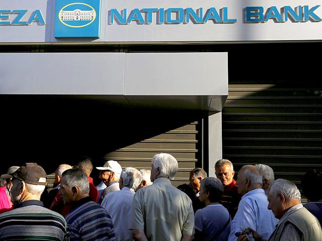 Dozens-of-pensioners-line-up-outside-a-branch-of-the-National-Bank-of-Greece-hoping-to-get-their-pensions-in-Athens-Greece-closed-its-banks-and-imposed-capital-controls-on-Sunday-to-check-the-growing-strains-on-its-crippled-financial-system-bringing-the-prospect-of-being-forced-out-of-the-euro-into-plain-sight--Reuters Dozens-of-pensioners-line-up-outside-a-branch-of-the-National-Bank-of-Greece-hoping-to-get-their-pensions-in-Athens-Greece-closed-its-banks-and-imposed-capital-controls-on-Sunday-to-check-the-growing-strains-on-its-crippled-financial-system-bringing-the-prospect-of-being-forced-out-of-the-euro-into-plain-sight--Reuters