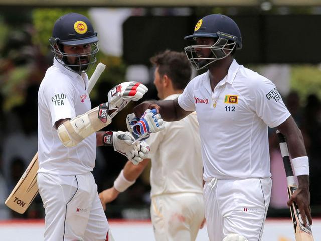 Sri-Lankan-captain-Angelo-Mathews-right-congratulates-Lahiru-Thirimanne-after-defeating-Pakistan-by-7-wickets-in-their-second-cricket-Test-match-in-Colombo-Sri-Lanka-on-June-29-2015-The-three-match-series-is-tied-1-1-AP-Photo Sri-Lankan-captain-Angelo-Mathews-right-congratulates-Lahiru-Thirimanne-after-defeating-Pakistan-by-7-wickets-in-their-second-cricket-Test-match-in-Colombo-Sri-Lanka-on-June-29-2015-The-three-match-series-is-tied-1-1-AP-Photo