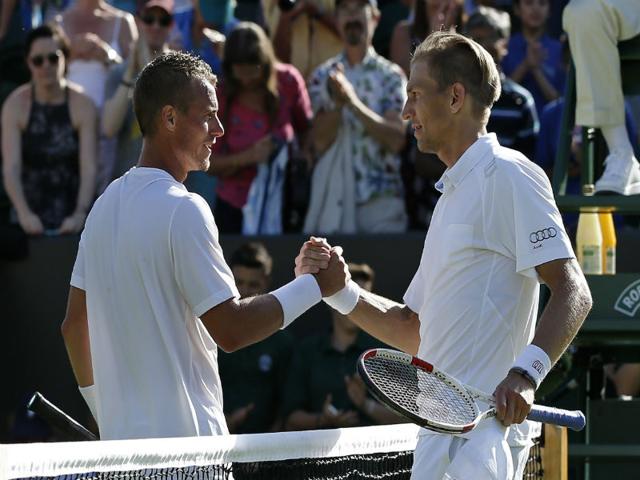 Lleyton-Hewitt-of-Australia-returns-a-ball-to-Jarkko-Nieminen-of-Finland-during-the-men-s-singles-first-round-match-at-the-All-England-Lawn-Tennis-Championships-in-Wimbledon-AP-Photo