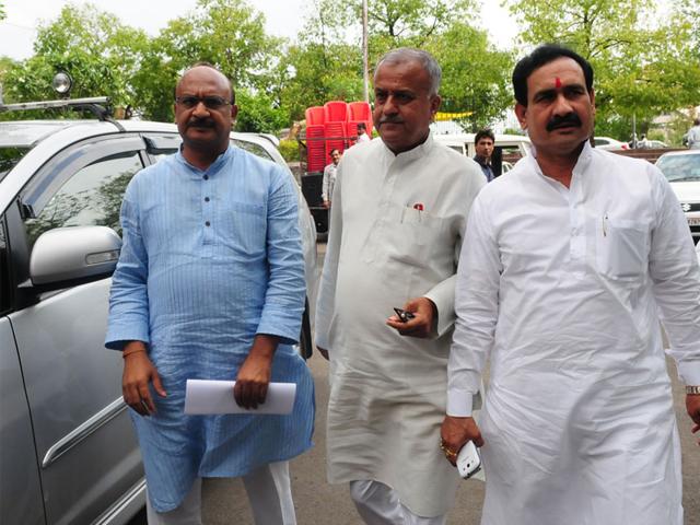 BJP state president Nand Kumar Singh Chauhan along with health minister Narottam Mishra at SIT office. (Mujeeb Faruqui/HT photo)
