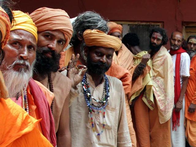 Sadhus stands in a queue for a medical checkup before their registration for the annual pilgrimage to the Amarnath cave shrine in Jammu on Tuesday. Nitin Kanotra/HT