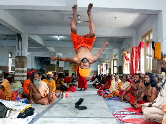 A Sadhu performs a somersault during an Amarnath Yatra camp in Jammu. (PTI Photo)