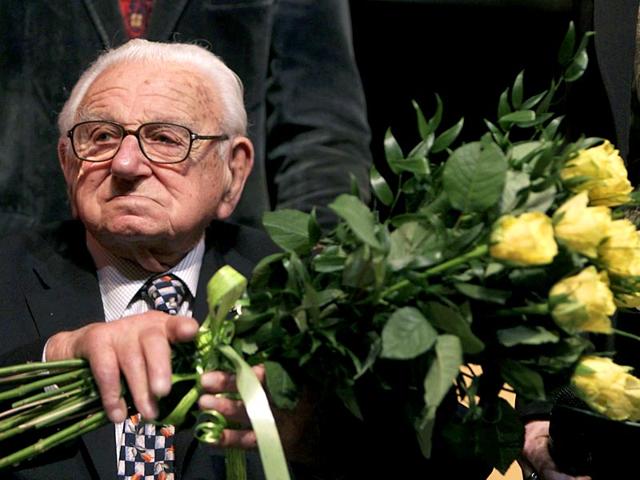 Nicholas-Winton-aged-101-holds-flowers-while-sitting-on-a-stage-after-the-premiere-of-the-movie-Nicky-s-family-which-is-based-on-his-life-story-in-Prague-Reuters-Photo Nicholas-Winton-aged-101-holds-flowers-while-sitting-on-a-stage-after-the-premiere-of-the-movie-Nicky-s-family-which-is-based-on-his-life-story-in-Prague-Reuters-Photo