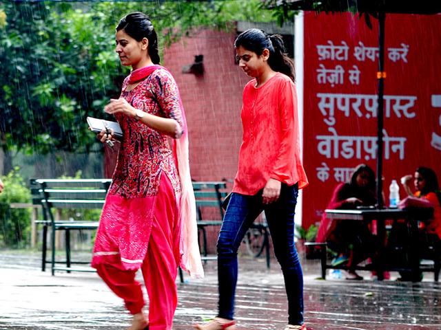 Students-strolling-through-rain-at-Panjab-University-Student-Centre-in-Chandigarh-on-Thursday-Ravi-Kumar-HT-Photo