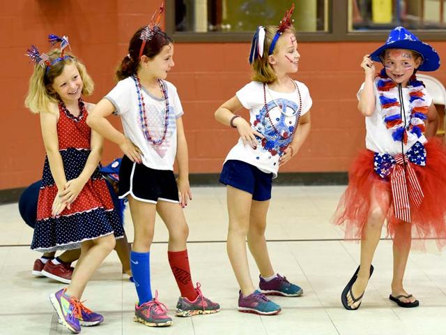 Kids strike their best poses for the judges at the Fourth of July costume contest. (AP Photo)