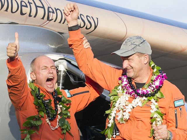 Solar-Impulse-2-pilot-Bertrand-Piccard-L-and-pilot-Andre-Borschberg-celebrate-after-Borschberg-landed-at-Kalaeloa-Airport-Hawaii-on-July-3-2015-AFP-Photo Solar-Impulse-2-pilot-Bertrand-Piccard-L-and-pilot-Andre-Borschberg-celebrate-after-Borschberg-landed-at-Kalaeloa-Airport-Hawaii-on-July-3-2015-AFP-Photo