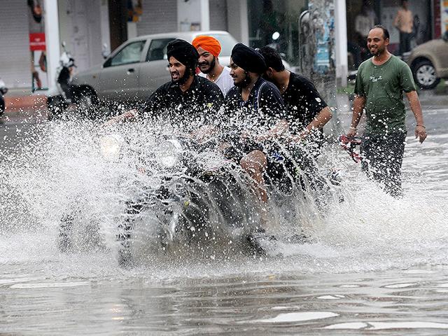 Children-play-during-heavy-rain-in-Chandigarh-HT-Photo Children-play-during-heavy-rain-in-Chandigarh-HT-Photo