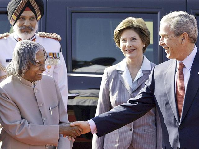 Kalam shakes hands with former US president George W Bush, right, as first lady Laura Bush, second right, looks on during Bush's ceremonial welcome at the Presidential Palace in New Delhi on March 2, 2006. (AP file photo)