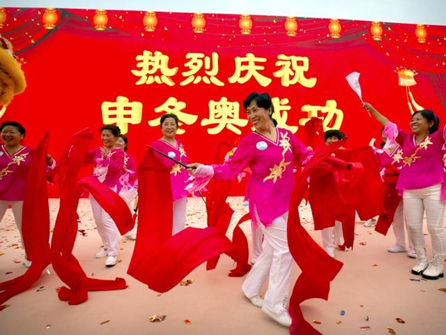 Celebrations-begin-outside-the-Beijing-Olympic-Stadium-also-known-as-the-Bird-s-Nest-in-Beijing-on-July-31-2015-following-the-announcement-that-the-city-will-host-the-2022-Winter-Olympics-The-sign-reads-Warm-celebration-of-the-successful-Winter-Olympics-bid-AP-Photo Celebrations-begin-outside-the-Beijing-Olympic-Stadium-also-known-as-the-Bird-s-Nest-in-Beijing-on-July-31-2015-following-the-announcement-that-the-city-will-host-the-2022-Winter-Olympics-The-sign-reads-Warm-celebration-of-the-successful-Winter-Olympics-bid-AP-Photo