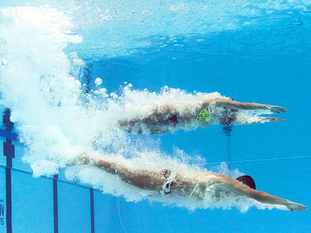 Italy's mixed duet team of Manila Flamini and Giorgio Minisini compete in the mixed duet technical preliminary during the synchronised swimming competition at the 2015 FINA (International Swimming Federation) World Aquatics Championships in Kazan, Russia. (AFP Photo) Italy's mixed duet team of Manila Flamini and Giorgio Minisini compete in the mixed duet technical preliminary during the synchronised swimming competition at the 2015 FINA (International Swimming Federation) World Aquatics Championships in Kazan, Russia. (AFP Photo)
