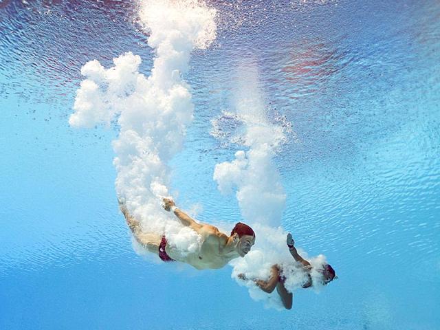 Silver medallists Maeghan Benfeito and Vincent Riendeau of Canada compete in the 10m platform synchronised mixed diving final. (AFP Photo) Silver medallists Maeghan Benfeito and Vincent Riendeau of Canada compete in the 10m platform synchronised mixed diving final. (AFP Photo)