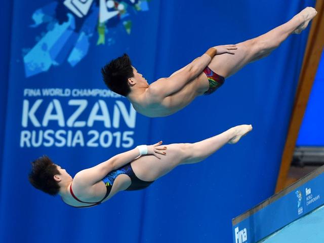 China's Si Yajie and Tai Xiaohu compete in the 10m platform synchronised mixed diving final. (AFP Photo) China's Si Yajie and Tai Xiaohu compete in the 10m platform synchronised mixed diving final. (AFP Photo)