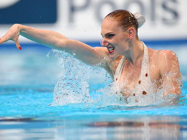 Russia's Svetlana Romashina competes in the women's solo technical final during the synchronised swimming competition. (AFP Photo) Russia's Svetlana Romashina competes in the women's solo technical final during the synchronised swimming competition. (AFP Photo)