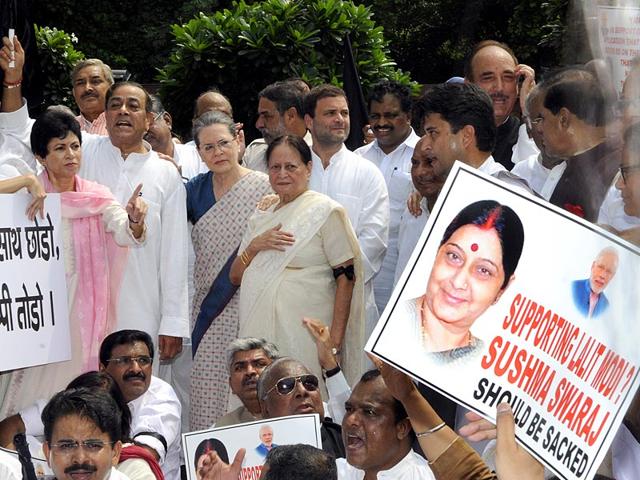 Congress president Sonia Gandhi and vice-president Rahul Gandhi shout slogans with the party members near the Gandhi Statue at Parliament complex on Tuesday. Congress is protesting against the suspension of their 25 MPs by the Lok Sabha Speaker. (HT Photo/Sonu Mehta)