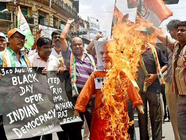 Congress workers burn the effigy of Prime Minister Narendra Modi during a protest rally in Kolkata on Tuesday. (PTI Photo/Ashok Bhaumik)
