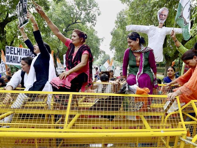 Mahila Congress workers protest against outside the BJP officer New Delhi on Tuesday. (PTI Photo/Kamal Kishore)