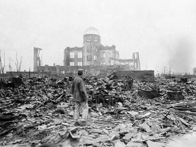 In this Sept 8, 1945 file photo, an allied correspondent stands in the rubble in front of the shell of a building that once was a exhibition center and government office in Hiroshima, Japan, a month after the first atomic bomb ever used in warfare was dropped by the US on Aug. 6, 1945. (AP Photo/Stanley Troutman, File) In this Sept 8, 1945 file photo, an allied correspondent stands in the rubble in front of the shell of a building that once was a exhibition center and government office in Hiroshima, Japan, a month after the first atomic bomb ever used in warfare was dropped by the US on Aug. 6, 1945. (AP Photo/Stanley Troutman, File)