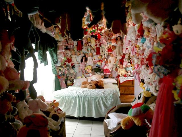 Rojas' bedroom is decorated with dolls all over the walls and the ceiling. (Reuters Photo/ Juan Carlos Ulate)