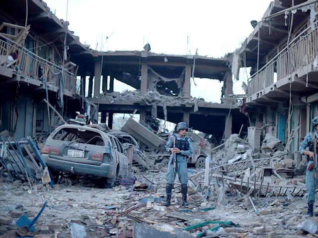Afghan-policemen-stand-gaurd-at-a-market-destroyed-by-a-powerful-truck-bomb-in-Kabul-AFP-Photo Afghan-policemen-stand-gaurd-at-a-market-destroyed-by-a-powerful-truck-bomb-in-Kabul-AFP-Photo