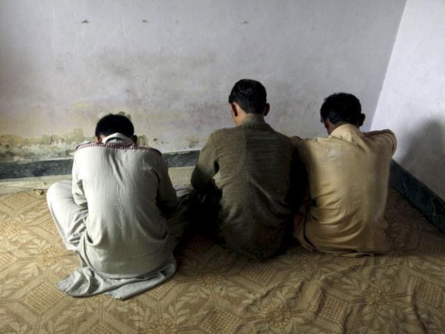 Children-who-have-been-reportedly-abused-turn-their-backs-to-the-camera-while-they-are-interviewed-in-their-village-of-Husain-Khan-Wala-of-Punjab-province-in-Pakistan-Accounts-of-the-shocking-child-abuse-scandal-in-Husain-Khan-Wala-were-splashed-across-the-front-pages-of-Pakistani-newspapers-over-the-weekend-Reuters-Mohsin-Raza