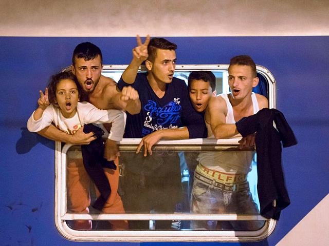 Migrants react as they wait in a train near the Slovenian-Croatian border seeking a new route into Schengen , after neighbouring Hungar fenced off its own border with Serbia. (AFP Photo) Migrants react as they wait in a train near the Slovenian-Croatian border seeking a new route into Schengen , after neighbouring Hungar fenced off its own border with Serbia. (AFP Photo)