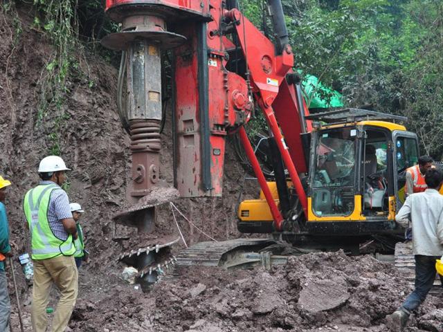 Three workers were trapped in the tunnel being built in the northern state of Himachal Pradesh after a cave-in blocked the entrance with tonnes of earth and boulders on September 12. (AFP Photo) Three workers were trapped in the tunnel being built in the northern state of Himachal Pradesh after a cave-in blocked the entrance with tonnes of earth and boulders on September 12. (AFP Photo)