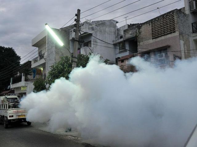 Public health department officials fogging a locality in Sector 41, Chandigarh, on Saturday. (Ravi Kumar/HT)