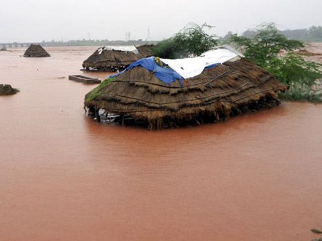 Mud houses of Gujjar's submerged after water levels rose on the banks of the River Tawi during the 2014 floods. HT File Photo Mud houses of Gujjar's submerged after water levels rose on the banks of the River Tawi during the 2014 floods. HT File Photo