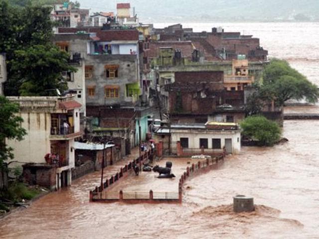 A view of a residential area during heavy rainfall in Jammu during the 2014 floods that wreaked havoc in the Valley. HT File Photo A view of a residential area during heavy rainfall in Jammu during the 2014 floods that wreaked havoc in the Valley. HT File Photo