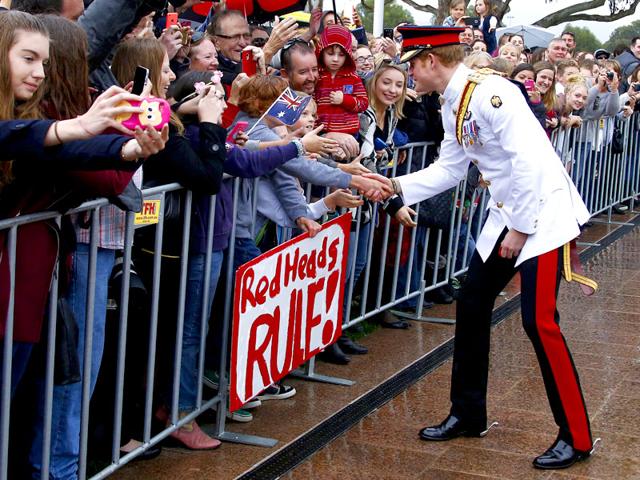 Prince Harry (R) shakes hands with members of the public after visiting the Australian War Memorial in Canberra. (Reuters)