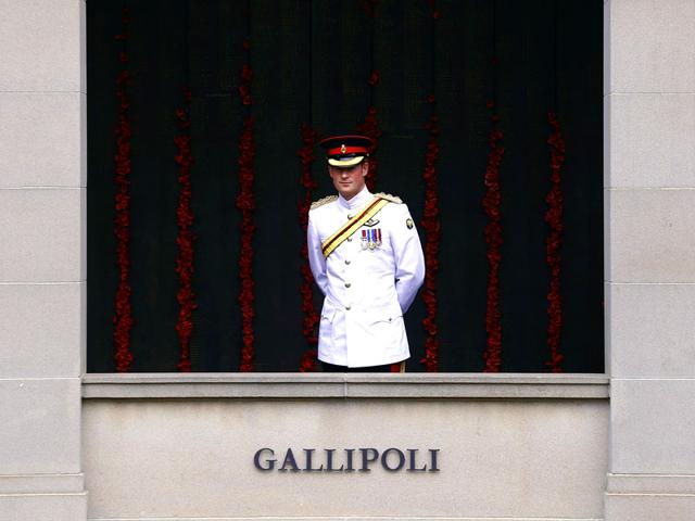 Britain's Prince Harry looks out along the Roll of Honour during a visit to the Australian War Memorial in Canberra. (AFP Photo)