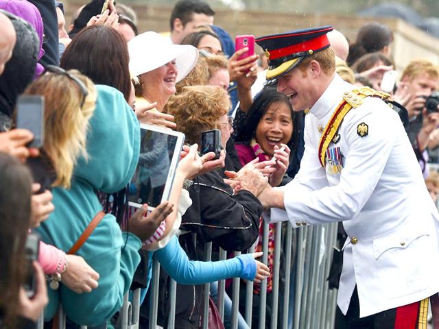 Prince Harry shakes hands with members of the public after visiting the Australian War Memorial in Canberra. (Reuters)