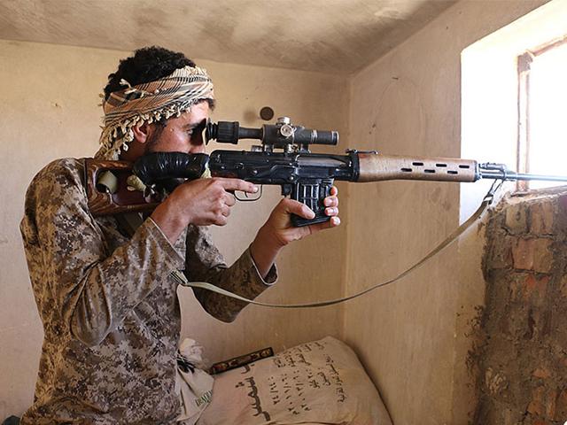 In this photo an IS militant looks through the scope of his rifle in Kirkuk, northern Iraq. Though best known for its horrific brutalities, the IS group has proved to be a highly organized and flexible fighting force. (Photo: Militant website via AP) In this photo an IS militant looks through the scope of his rifle in Kirkuk, northern Iraq. Though best known for its horrific brutalities, the IS group has proved to be a highly organized and flexible fighting force. (Photo: Militant website via AP)