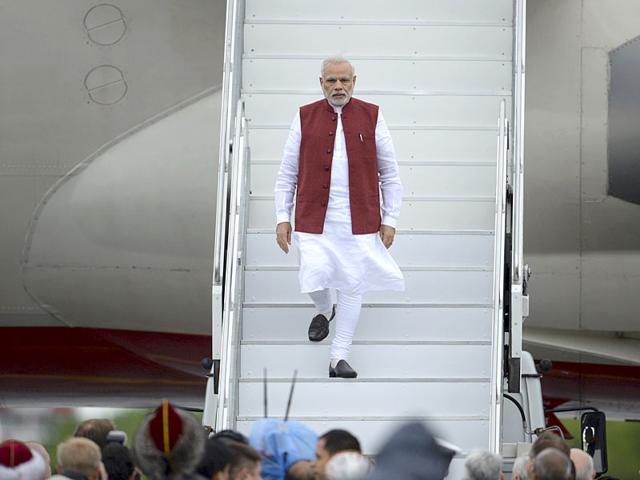 Prime Minister Narendra Modi disembarks a plane upon his arrival before attending the BRICS and the Shanghai Cooperation Organization (SCO) summits in Ufa, Russia. (Reuters)