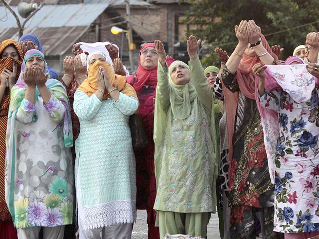 Kashmiri Muslim devotees pray early in the morning at the Hazratbal shrine, during special prayers to observe the Martyr Day of Hazrat Ali in Srinagar (AP Photo) Kashmiri Muslim devotees pray early in the morning at the Hazratbal shrine, during special prayers to observe the Martyr Day of Hazrat Ali in Srinagar (AP Photo)