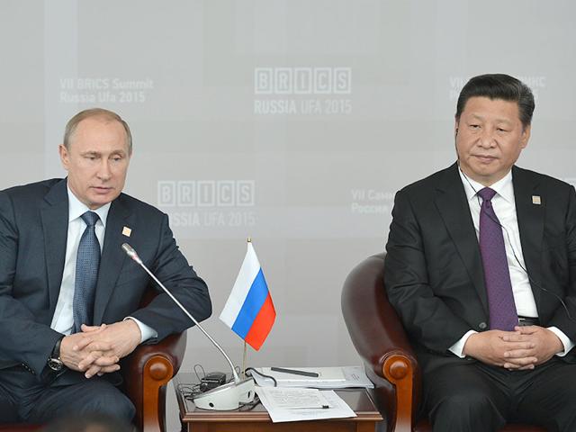 Russian President Vladimir Putin, left, meets Chinese President Xi Jinping at the BRICS summit, in Ufa. (Host photo agency/RIA Novosti Pool Photo via AP)