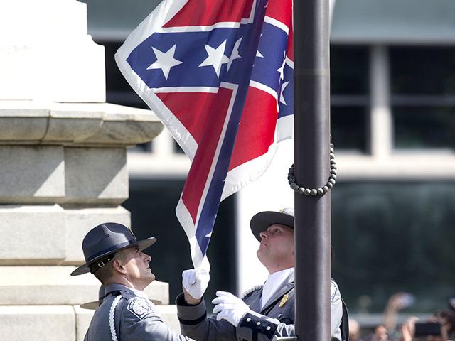 The Confederate battle flag flies on its last full day at the South Carolina state house on July 9, South Carolina. Governor Nikki Haley signed a bill removing the Confederate battle flag from the state house grounds on Thursday afternoon. (AFP)