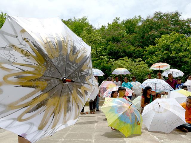 An umbrella workshop organised by Achyut Palav in Navi Mumbai displays colourfully painted umbrellas. (Photo: Bachchan Kumar)