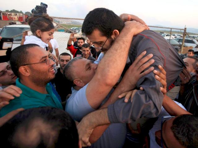 Palestinian hunger striker Khader Adnan greeted upon his release from an Israeli jail in the West Bank village of Arabeh. (Reuters Photo)