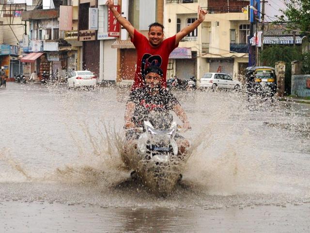 Young boys enjoying in the rain in Patiala on Sunday. Bharat Bhushan/HT