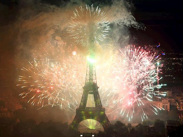 Fireworks light up the sky near the Eiffel Tower to end the traditional Bastille Day celebrations in Paris. (Reuters) Fireworks light up the sky near the Eiffel Tower to end the traditional Bastille Day celebrations in Paris. (Reuters)