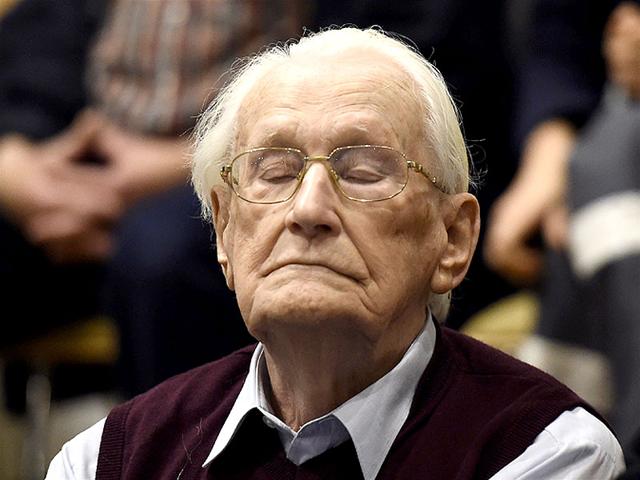 Convicted former SS officer Oskar Groening listens to the verdict of his trial at court in Lueneburg, northern Germany. (AFP Photo) Convicted former SS officer Oskar Groening listens to the verdict of his trial at court in Lueneburg, northern Germany. (AFP Photo)