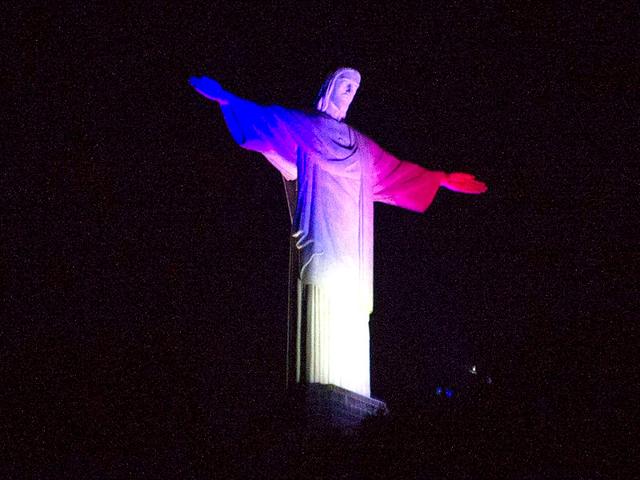 Rio de Janeiro's landmark the Christ the Redeemer statue is lit with the colours of the French flag to celebrate Bastille Day. (AFP Photo/Vanderlei Almeida) Rio de Janeiro's landmark the Christ the Redeemer statue is lit with the colours of the French flag to celebrate Bastille Day. (AFP Photo/Vanderlei Almeida)