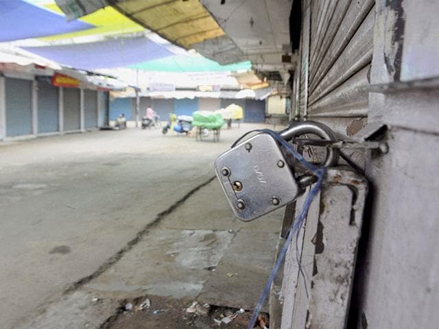 Shops remain closed at Chowk bazar during Madhya Pradesh Bandh called by the Congress against Vyapam Scam in Bhopal. (PTI Photo)