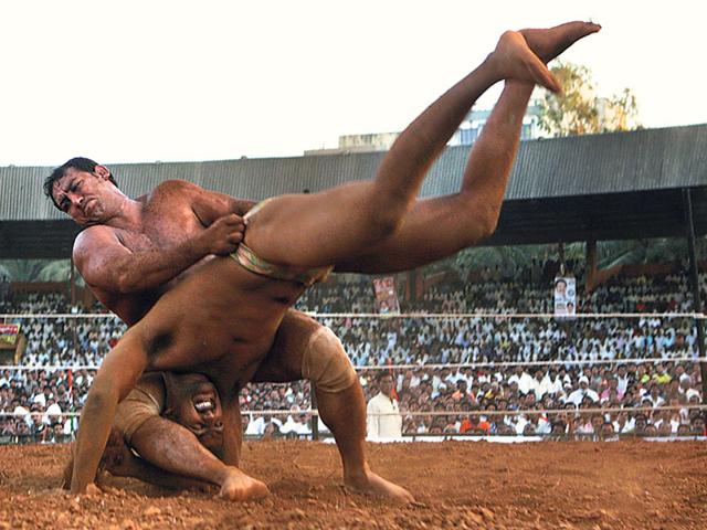 Wrestler Ahsab Ahmed (left), who eventually won the match, tries to overturn Nivrutti Bidge at the Andheri Sports Complex on February 1, 2009. This photo won the Silver Prize in the ‘Sports Photography’ category at the IFRA Awards. (Satish Bate/HT photo)