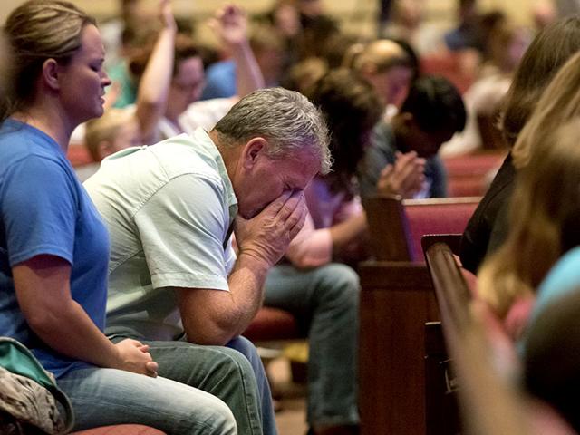 Corey Groce sits during a prayer vigil at Redemption Point Church for the victims of the shootings at a recruiting center and another US military site a few miles apart in Chattanooga. 24-year-old Mohammad Youssef Abdulazeez attacked the two centers killing four US marines. (AP Photo) Corey Groce sits during a prayer vigil at Redemption Point Church for the victims of the shootings at a recruiting center and another US military site a few miles apart in Chattanooga. 24-year-old Mohammad Youssef Abdulazeez attacked the two centers killing four US marines. (AP Photo)