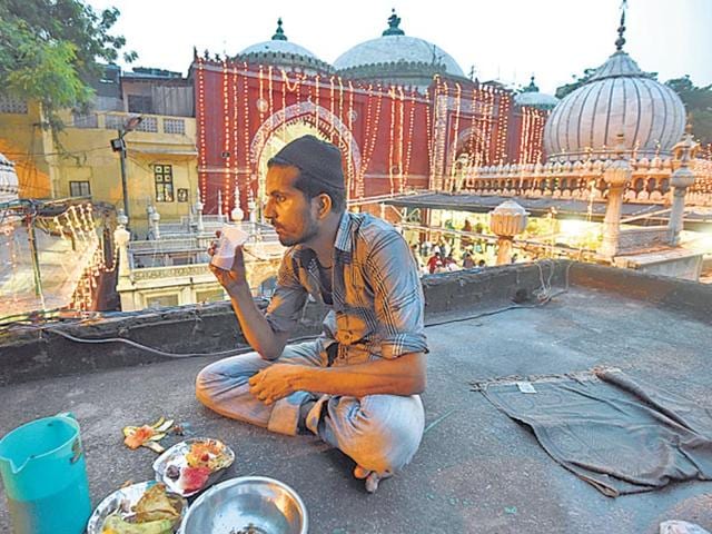 A man breaks his fast during Ramzan, that coincided with the Hindu Adhik Maas this year. A man breaks his fast during Ramzan, that coincided with the Hindu Adhik Maas this year.